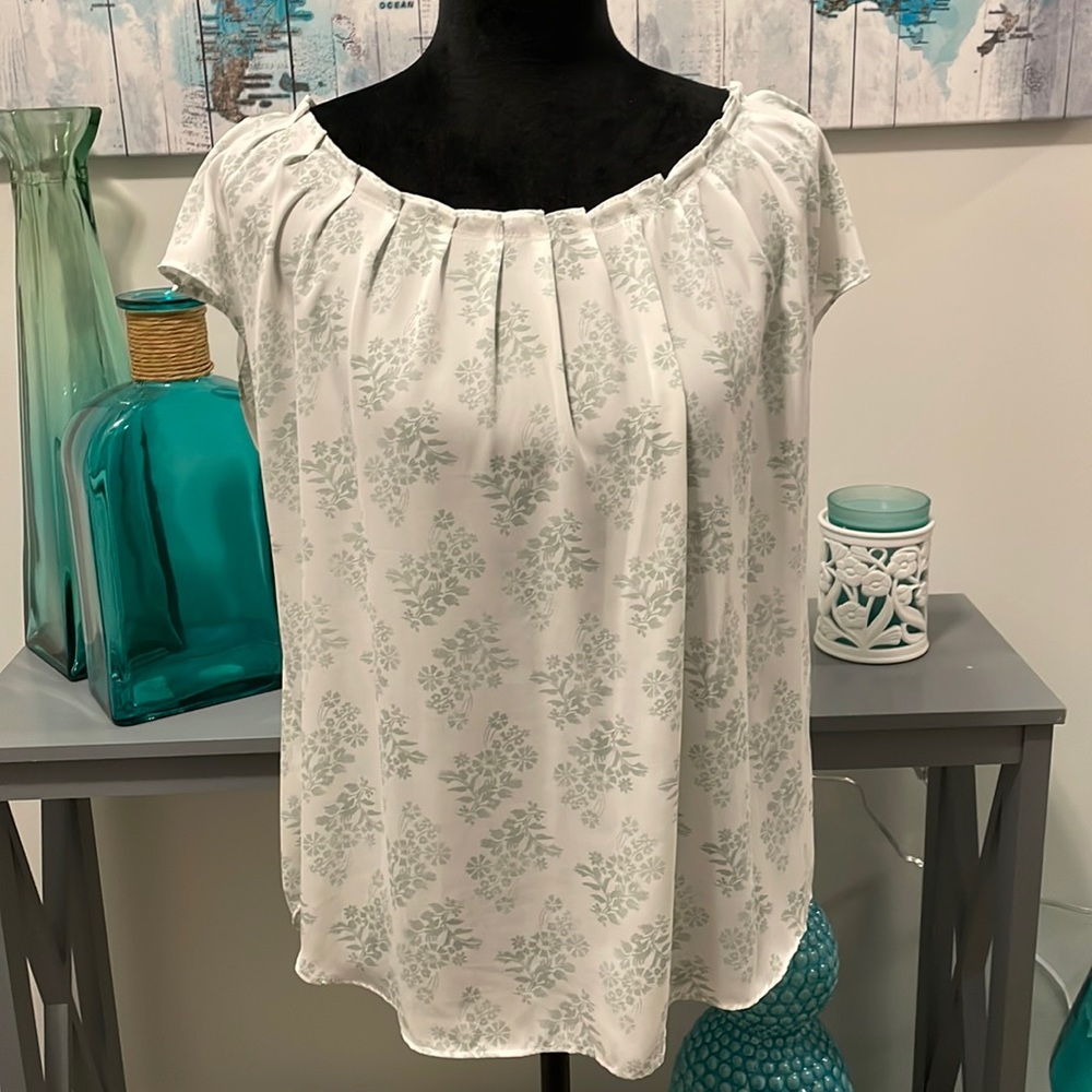 Green and white patterned blouse with boat neck